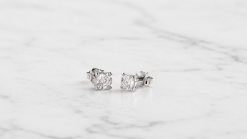 Certified lab-grown diamond ring on white marble — Stella Fine Jewellery