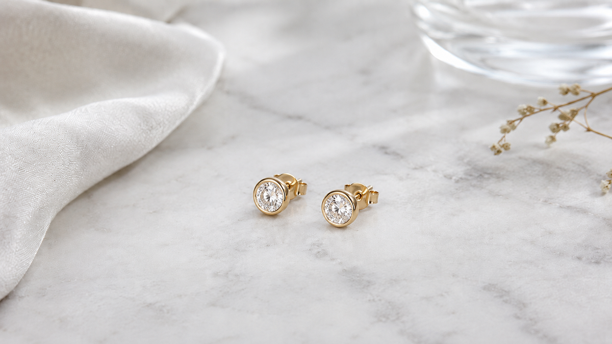 Woman wearing lab-grown diamond stud earrings and a delicate diamond bracelet for everyday wear — Stella Fine Jewellery