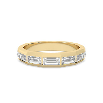 yellow Gold ring with baguette-cut diamonds on a gold background