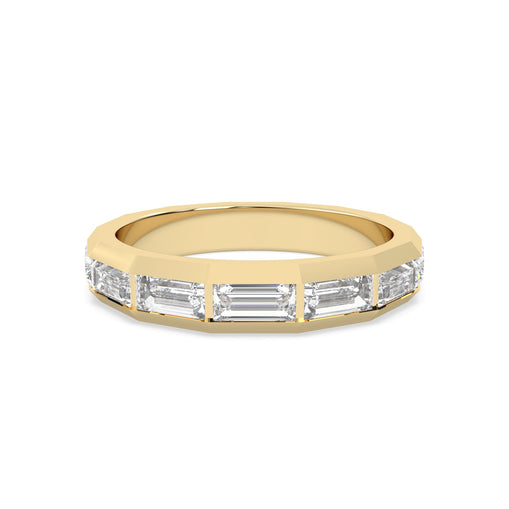 yellow Gold ring with baguette-cut diamonds on a gold background