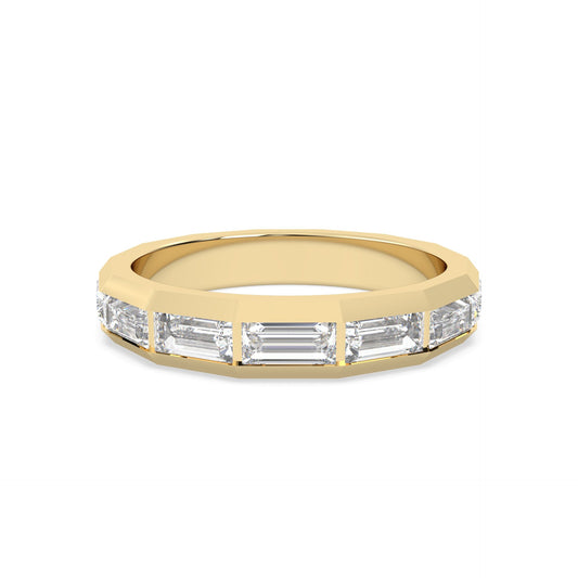 yellow Gold ring with baguette-cut diamonds on a gold background