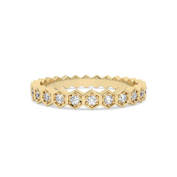 yellow gold ring with diamond accents on a white background