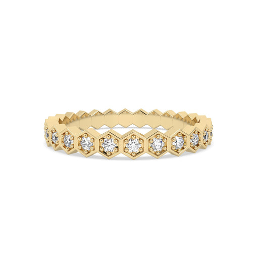 yellow gold ring with diamond accents on a white background
